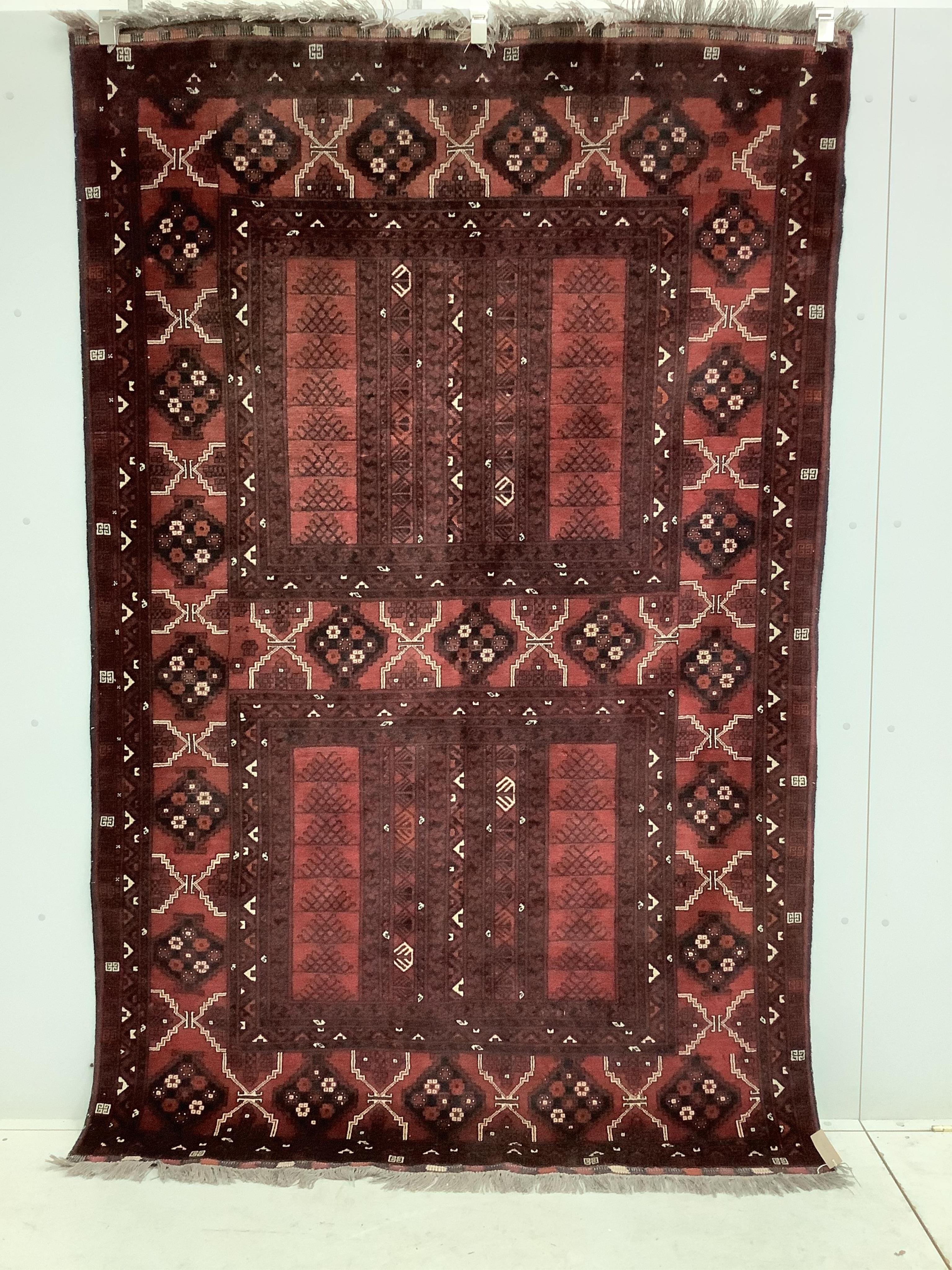 A Belouch red ground carpet, approximately 250cm x 160cm. Condition - fair to good